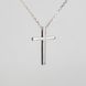 Silver pendant: Cross with embroidery ornament